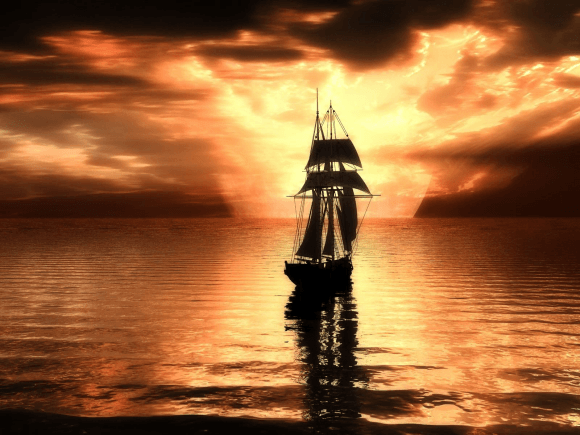 Setting sun and sailing Ship Wallpaper